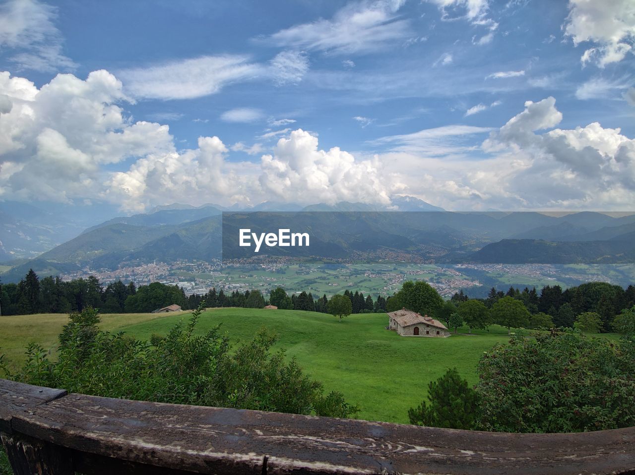 SCENIC VIEW OF FIELD AND MOUNTAINS AGAINST SKY