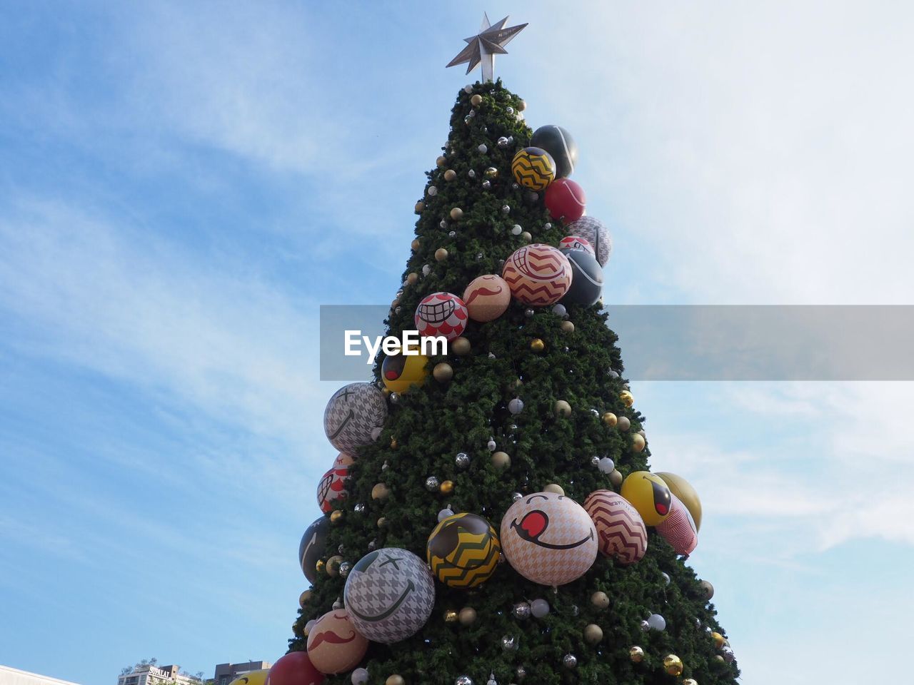 Low angle view of christmas tree against sky