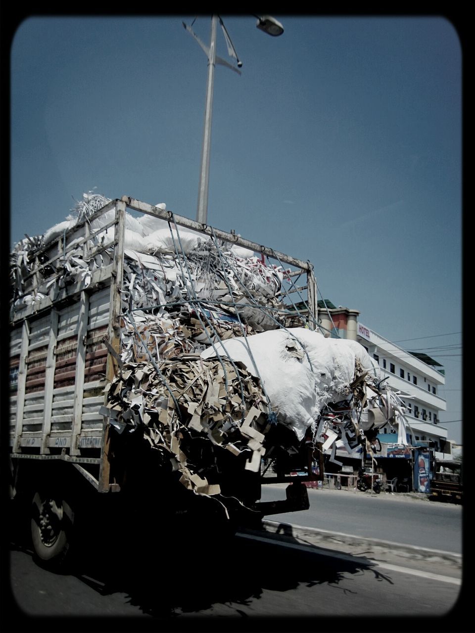 Cropped image of truck carrying scrap