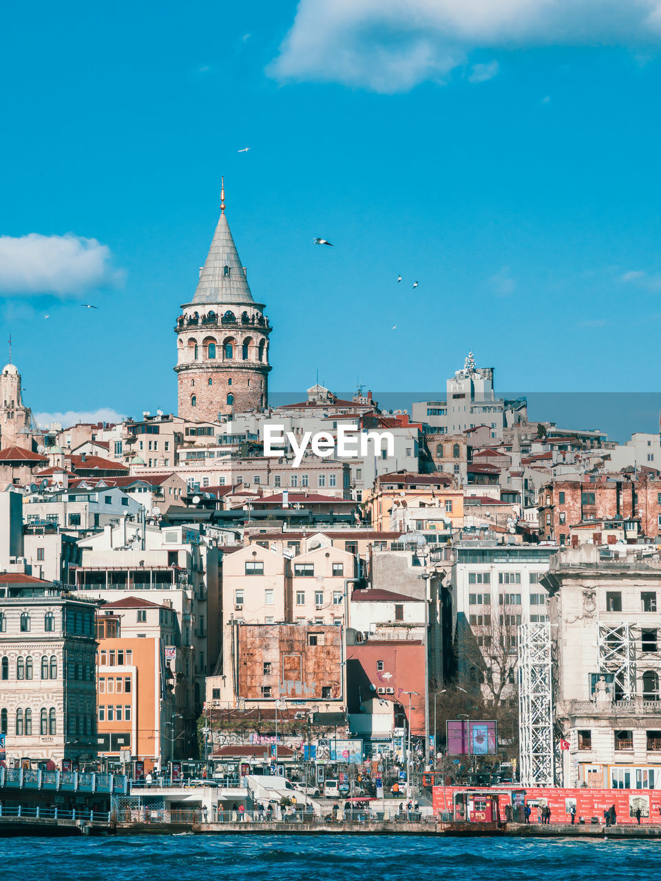 View of the galata tower through the golden horn, istanbul, turkey
