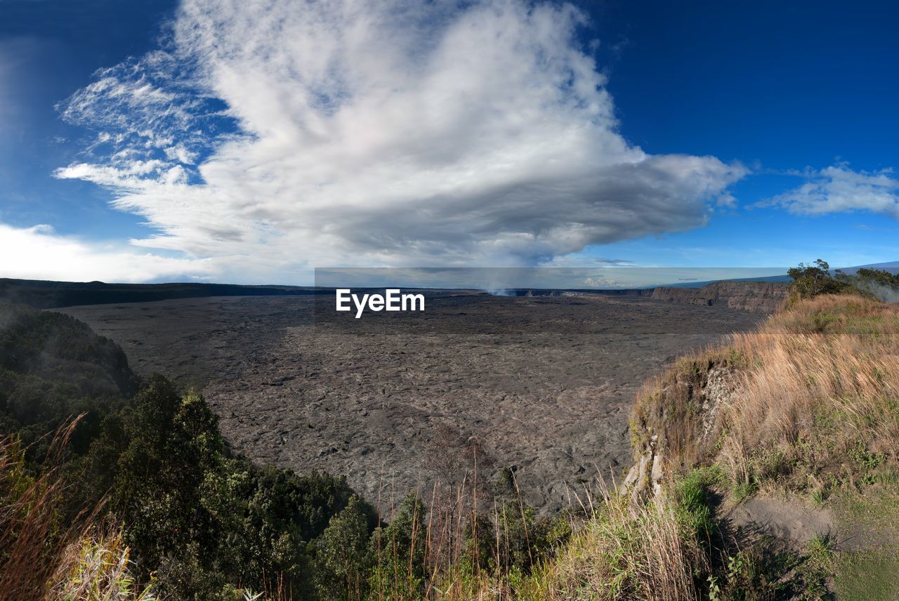 View of landscape against cloudy sky