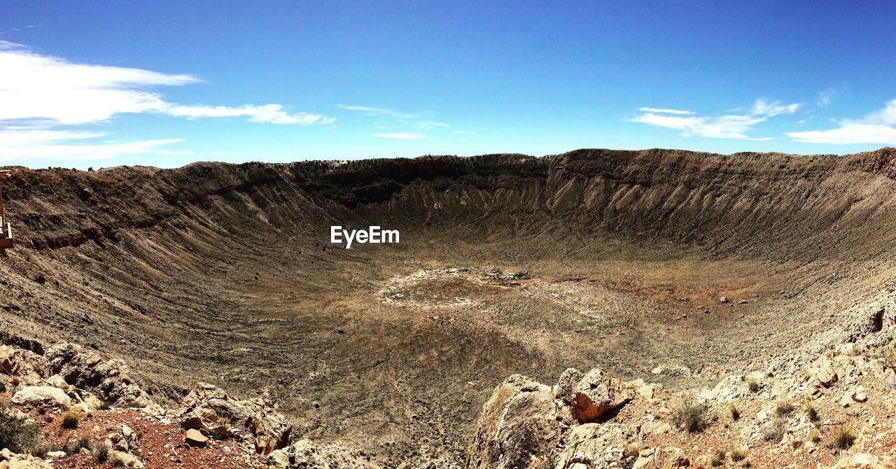 View of meteor crater against sky