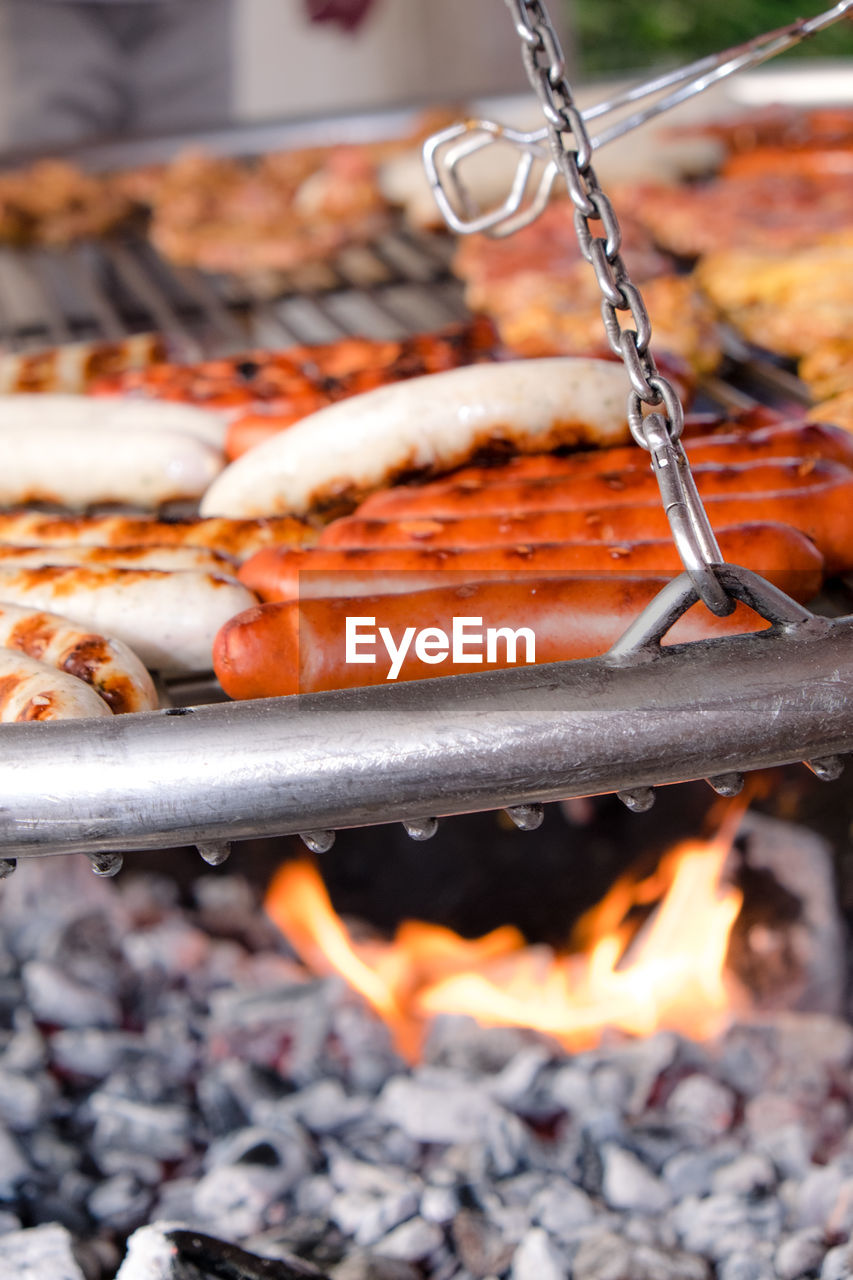 Close-up of sausages on barbecue grill