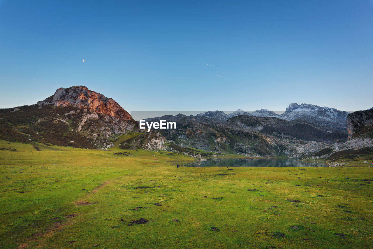 SCENIC VIEW OF MOUNTAINS AGAINST CLEAR BLUE SKY