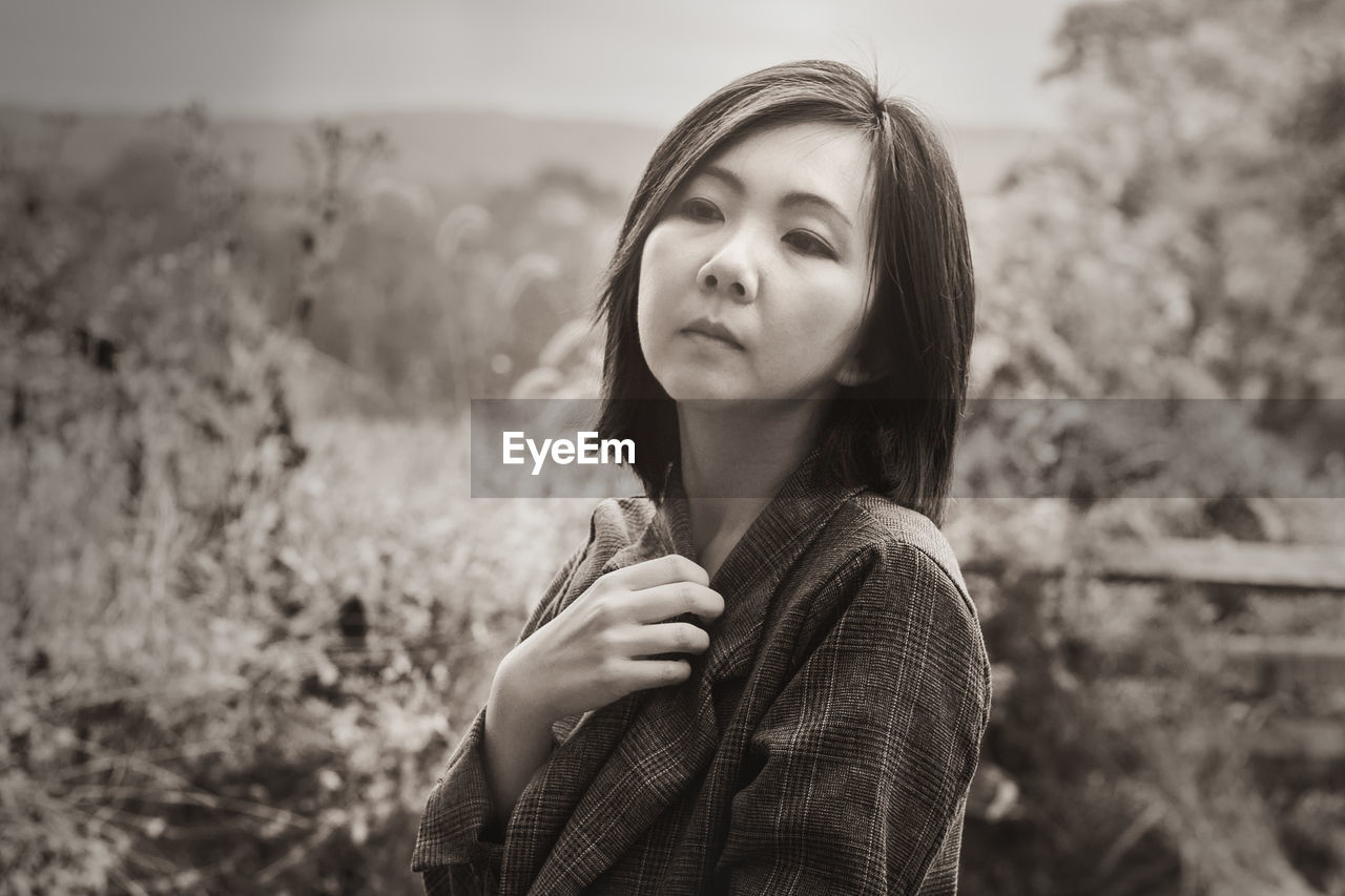 Portrait of young woman looking away