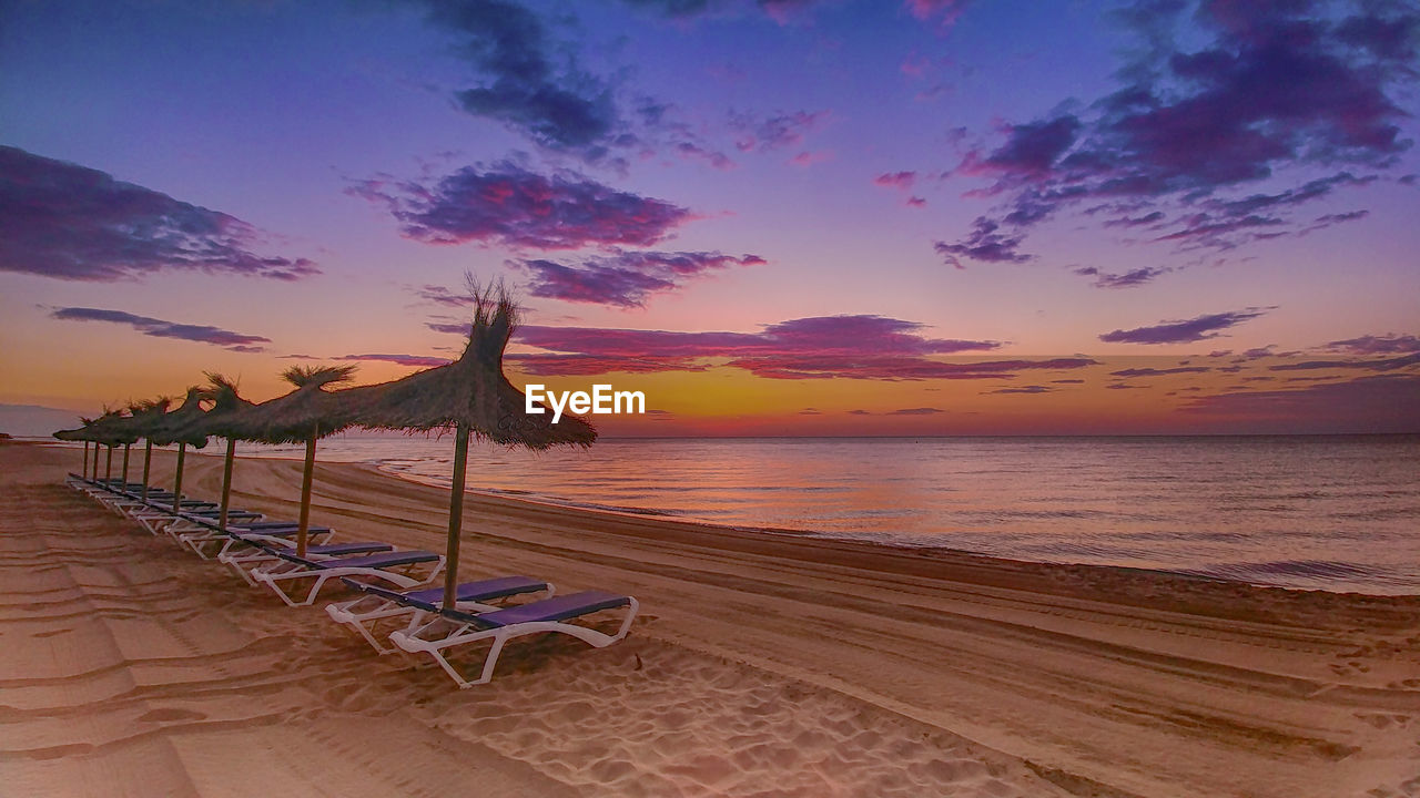 SCENIC VIEW OF BEACH DURING SUNSET