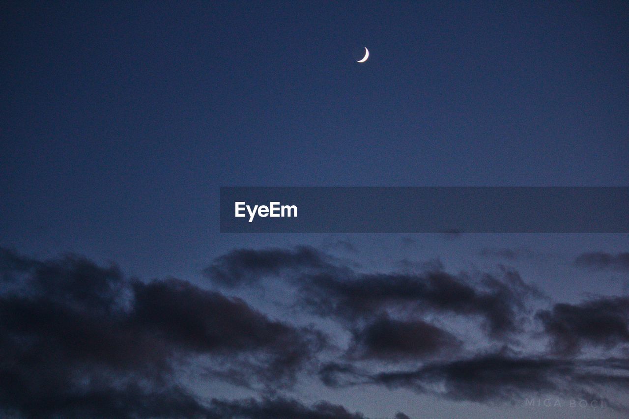 LOW ANGLE VIEW OF MOON AT SKY