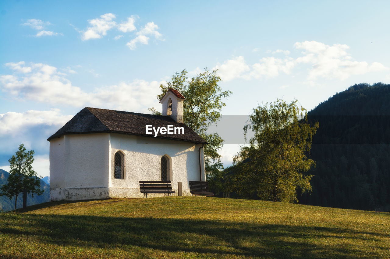 Church on field against sky