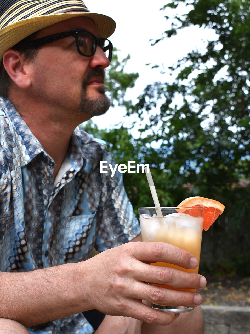 Midsection of man holding a drink