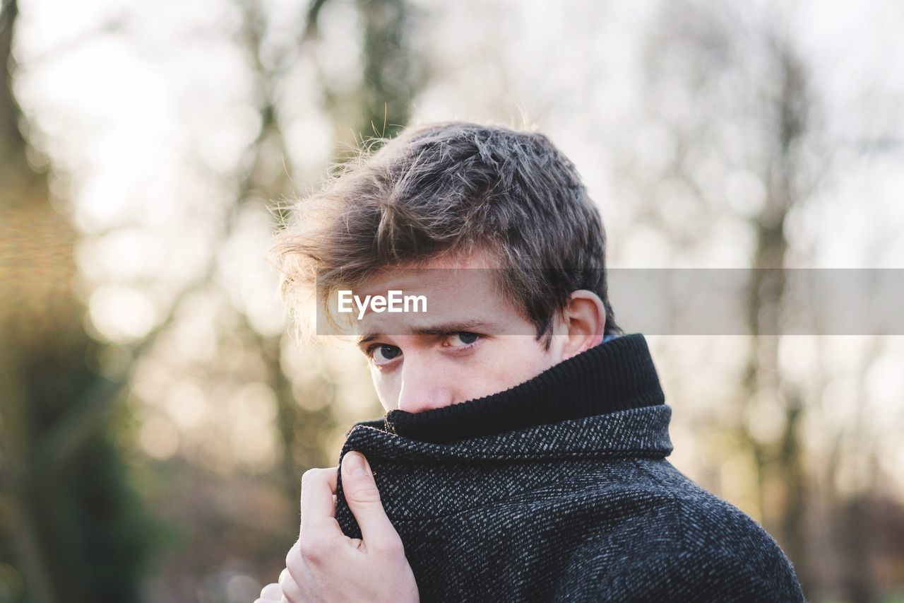 PORTRAIT OF YOUNG MAN WITH SNOW