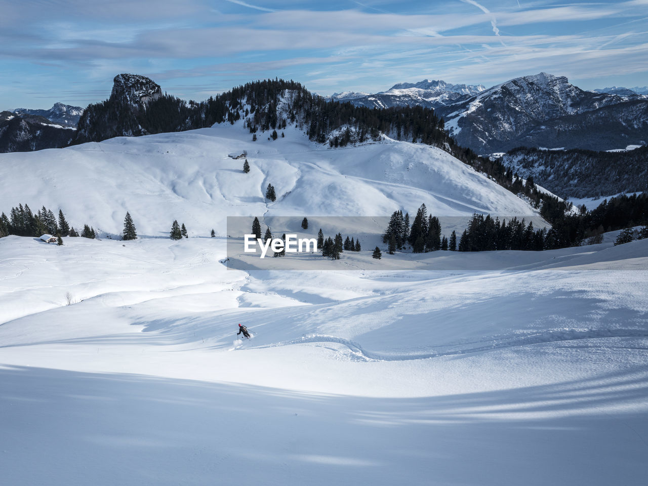 Man skiing on snow covered karkopf, lattengeburge, berchtesgadenerland, germany