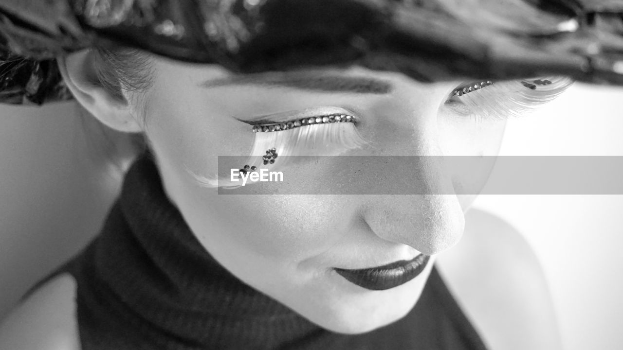 Close-up of young woman with false eyelash