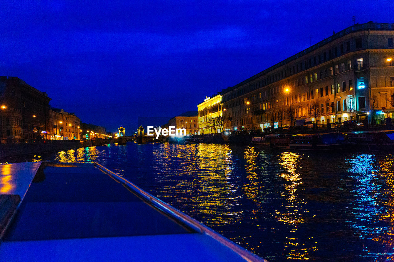 VIEW OF ILLUMINATED BUILDINGS AT NIGHT