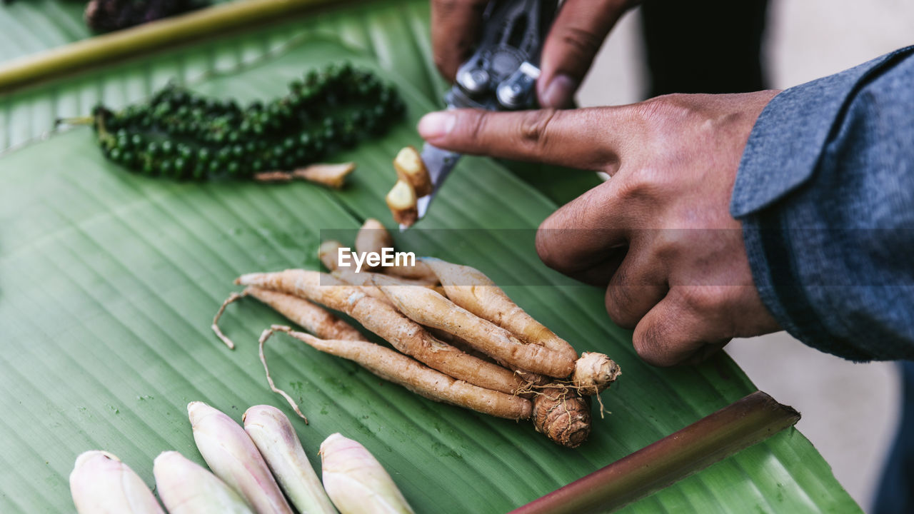 High angle view of person preparing food on table