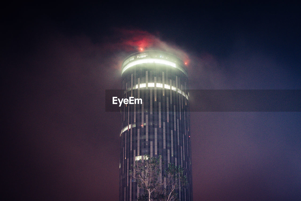 LOW ANGLE VIEW OF ILLUMINATED BUILDING