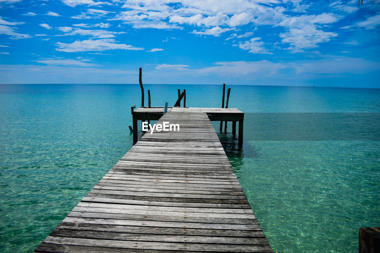 WOODEN JETTY ON PIER OVER SEA