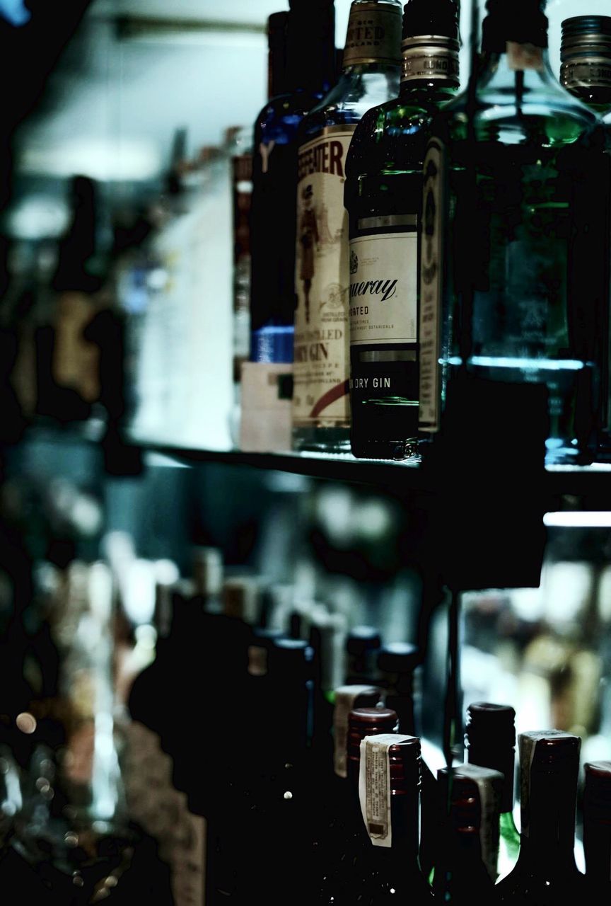 Gin bottles arranged on shelf in restaurant