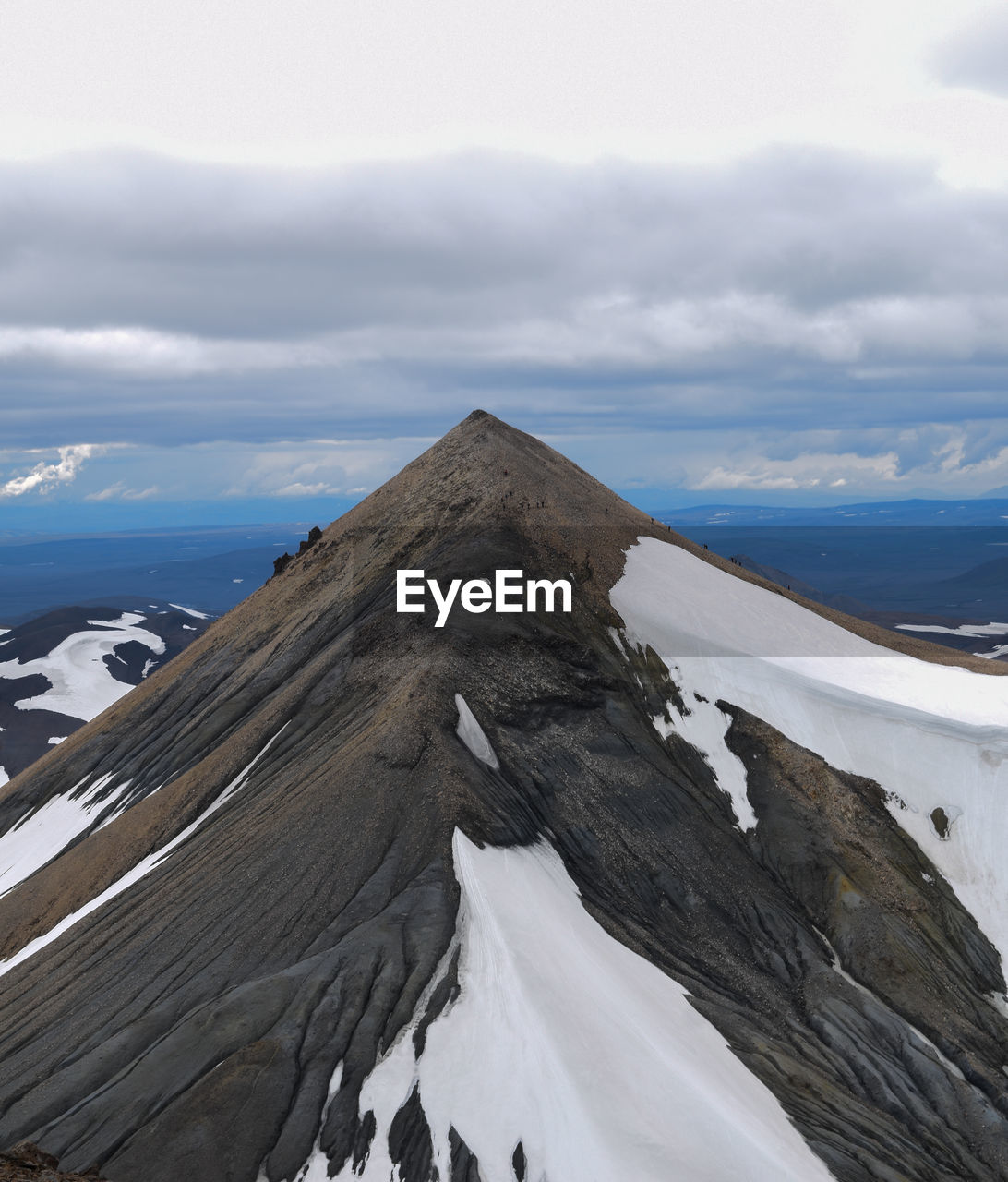 Scenic view of snow covered mountain against sky