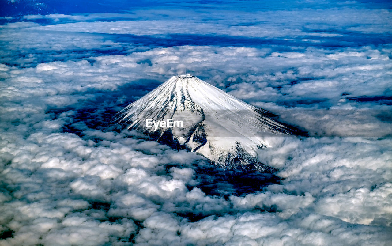Aerial view of snow covered fuji mountain  against sky