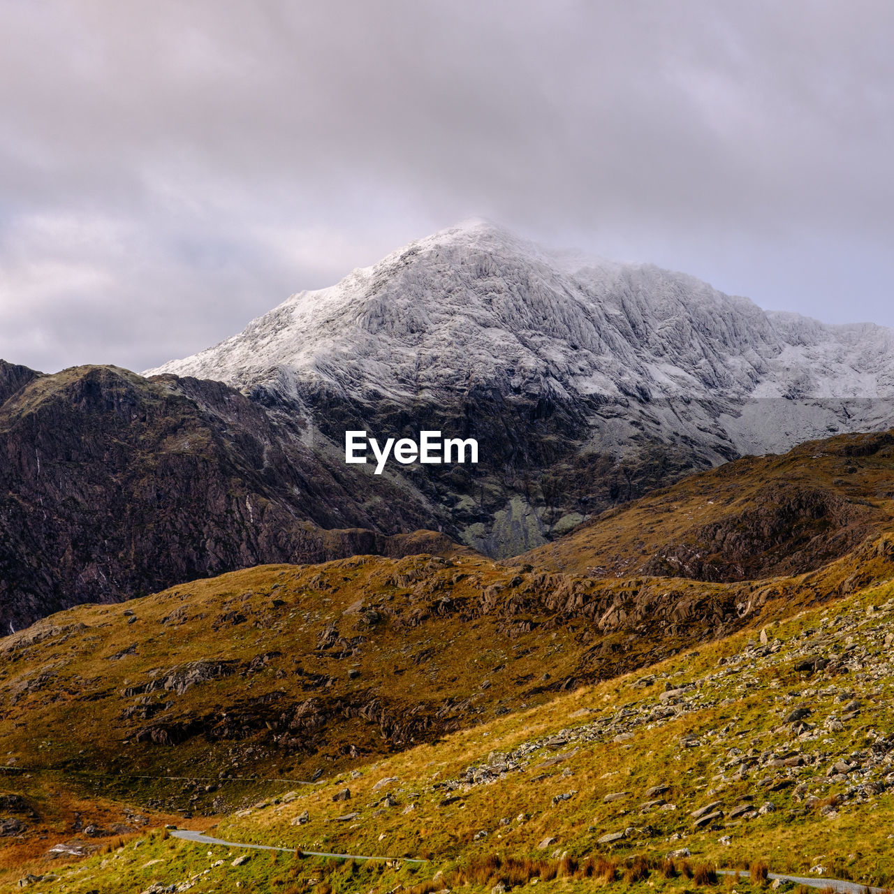 The snow covered summit of snowdon in snowdonia national park, north wales