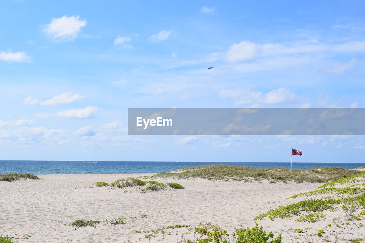 Scenic view of beach against sky