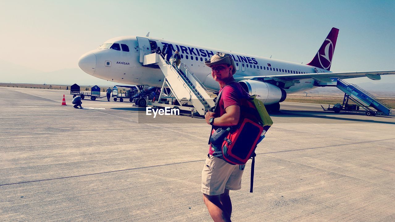 MAN WORKING AT AIRPLANE