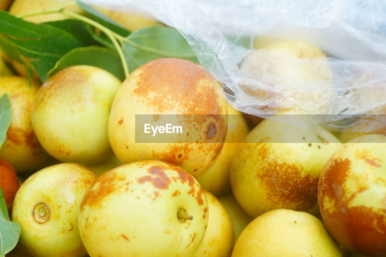 CLOSE-UP OF FRUITS FOR SALE IN MARKET STALL