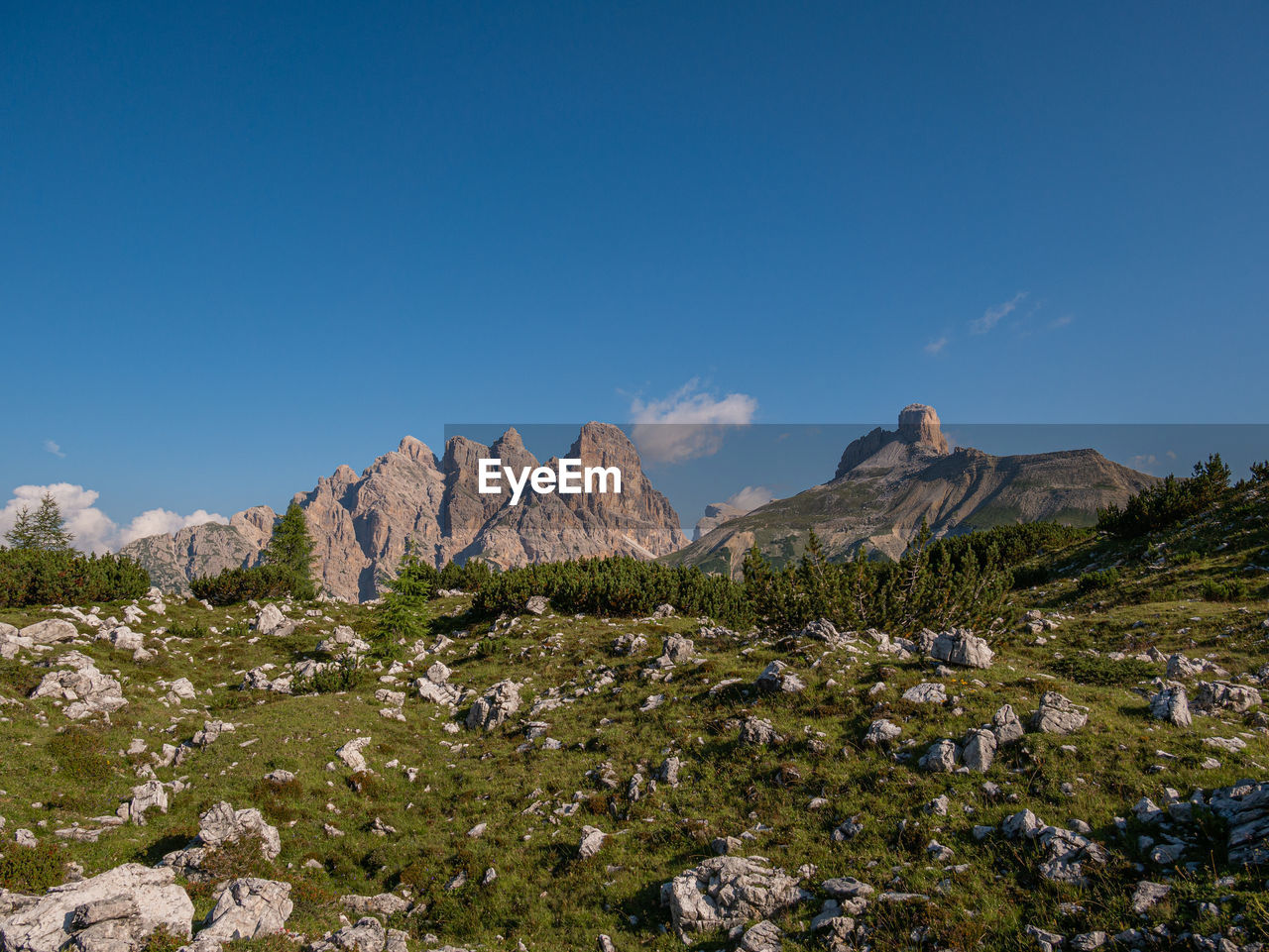 PANORAMIC VIEW OF MOUNTAINS AGAINST BLUE SKY