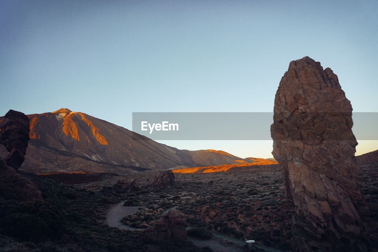 Scenic view of mountains against clear sky