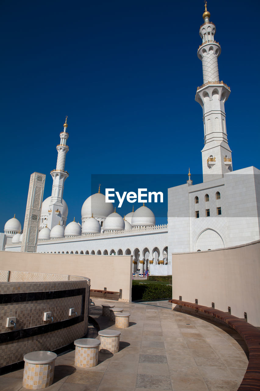 View of mosque against blue sky