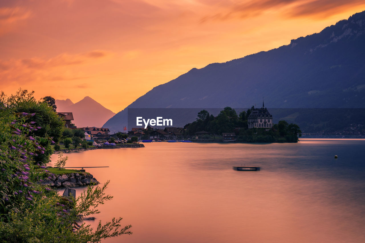 SCENIC VIEW OF SEA AGAINST ORANGE SKY