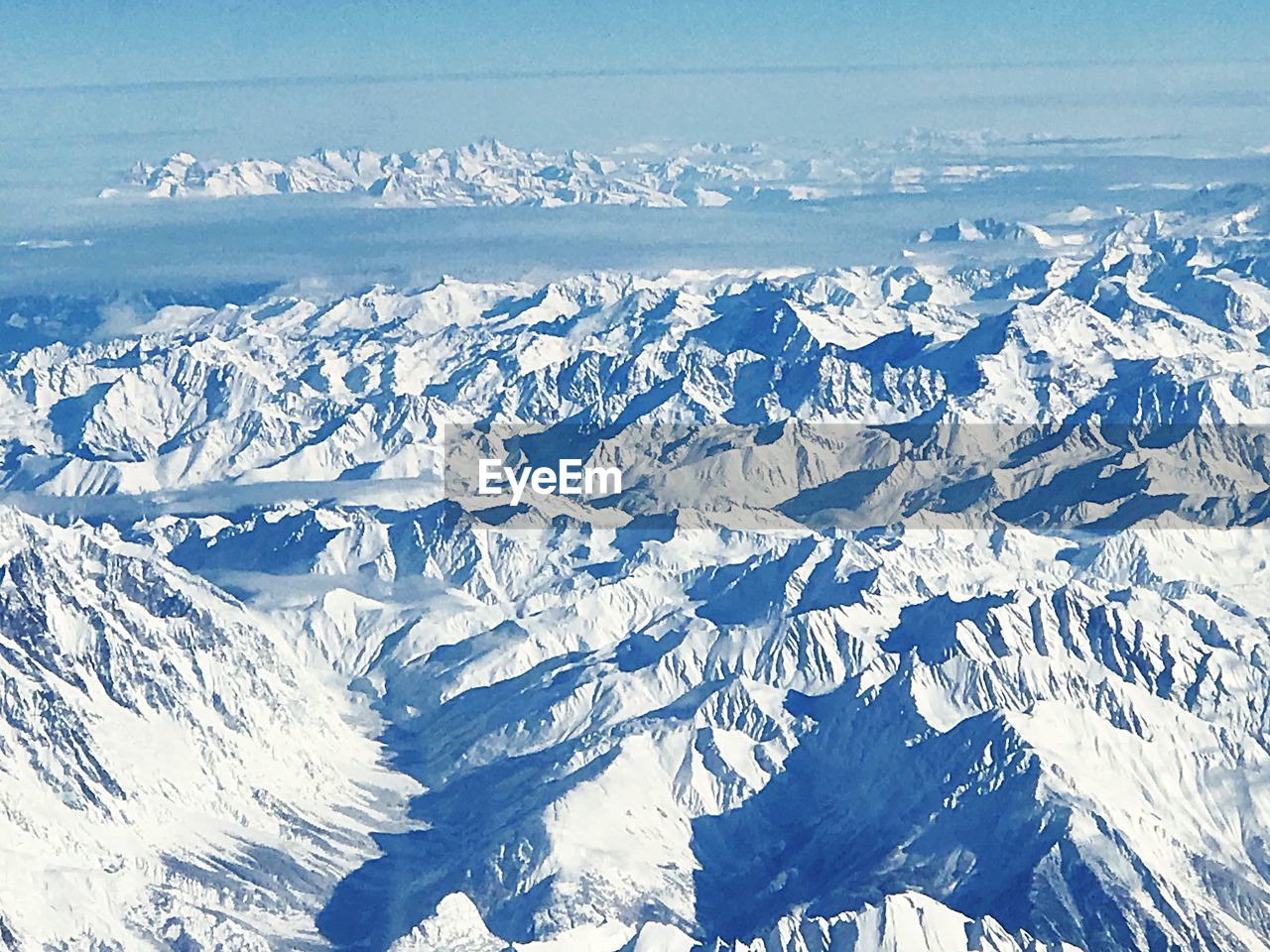 AERIAL VIEW OF SNOWCAPPED MOUNTAINS