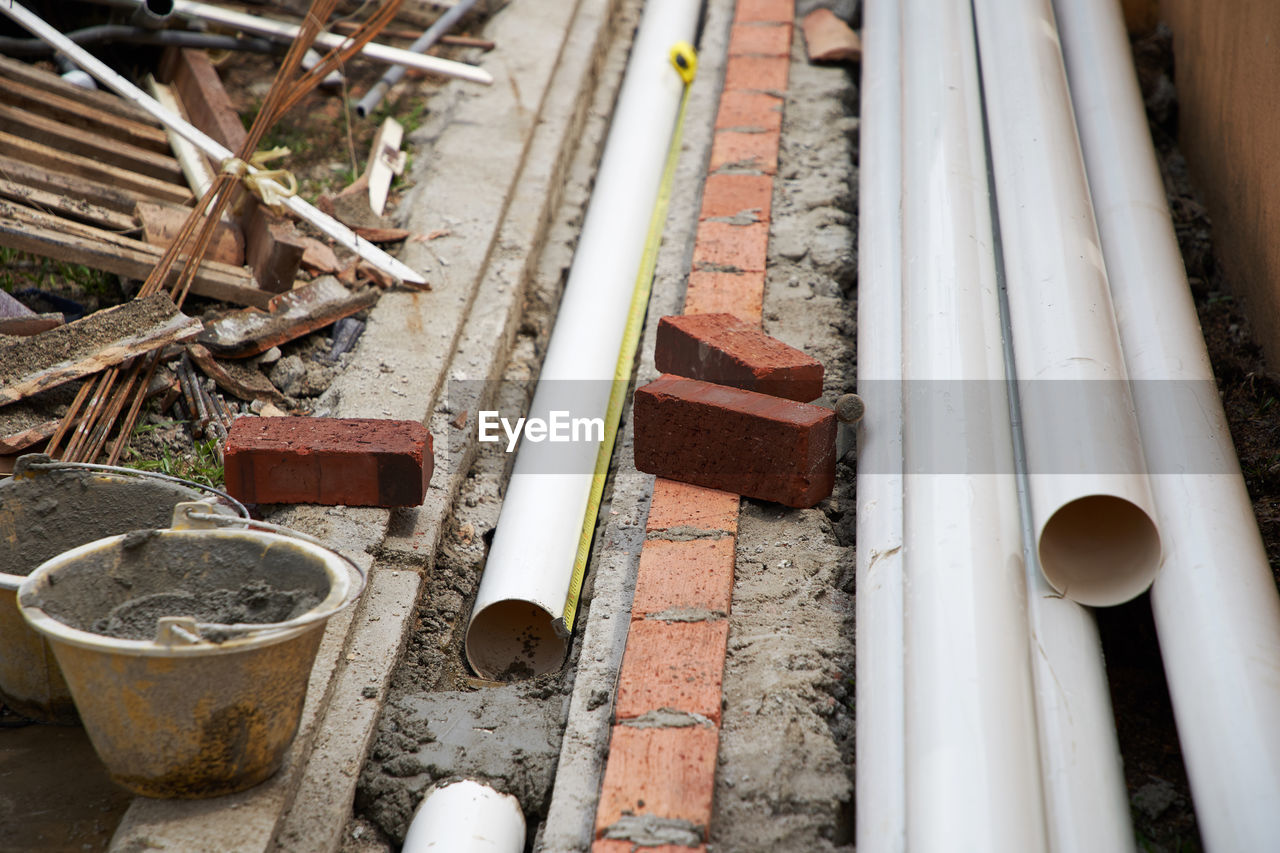 High angle view of installing sewerage pipes