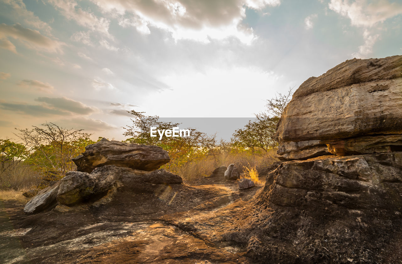 ROCK FORMATIONS ON LAND AGAINST SKY