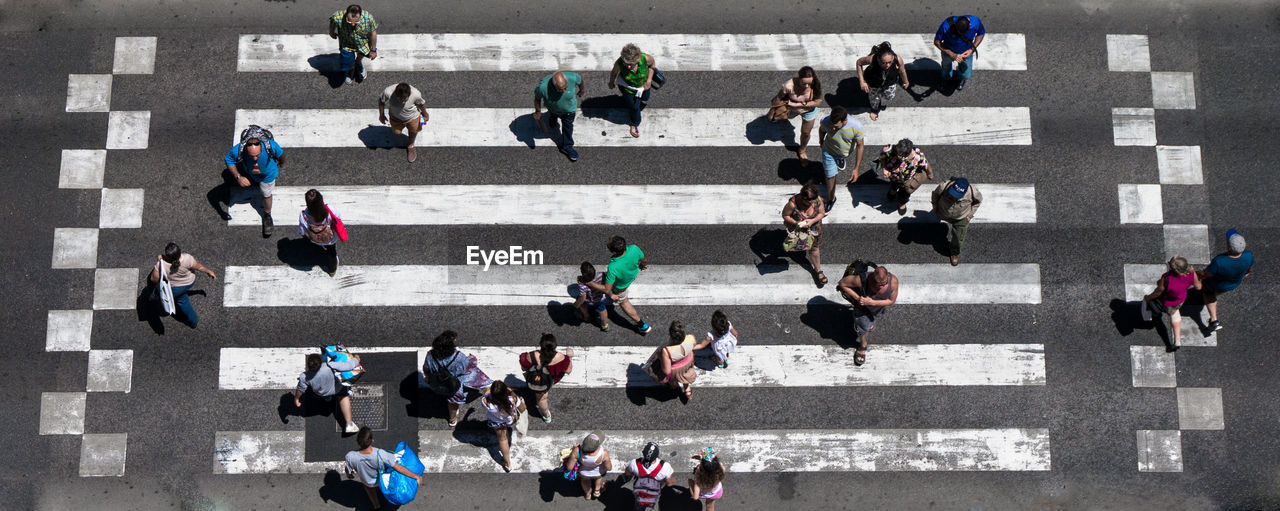 High angle view of people crossing road