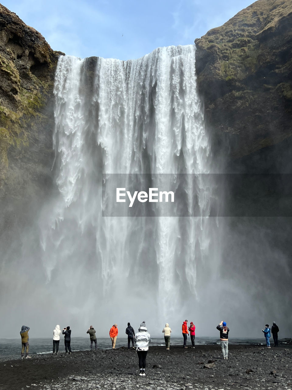 people walking on rock formations