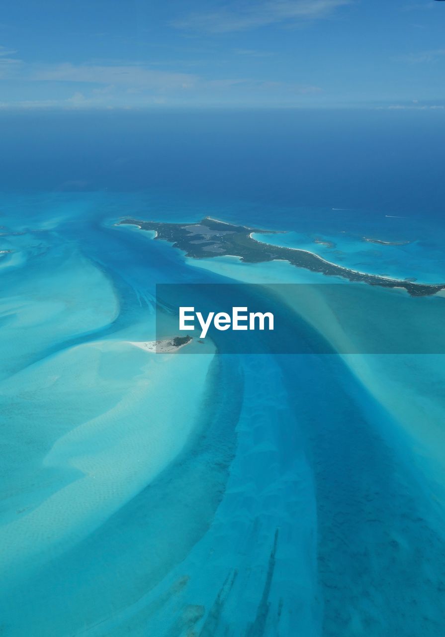 Aerial view of landscape against blue sky