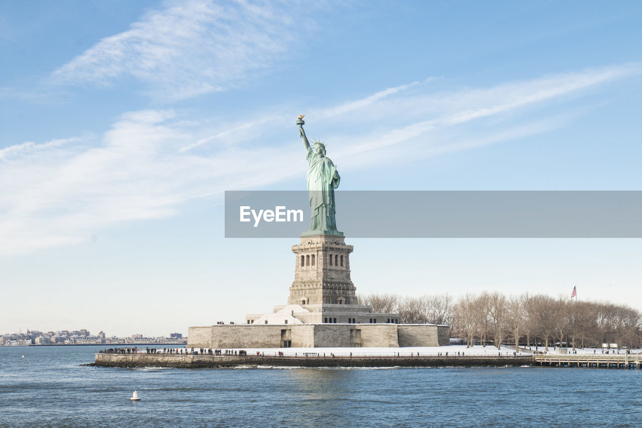 STATUE OF LIBERTY WITH CITY IN BACKGROUND