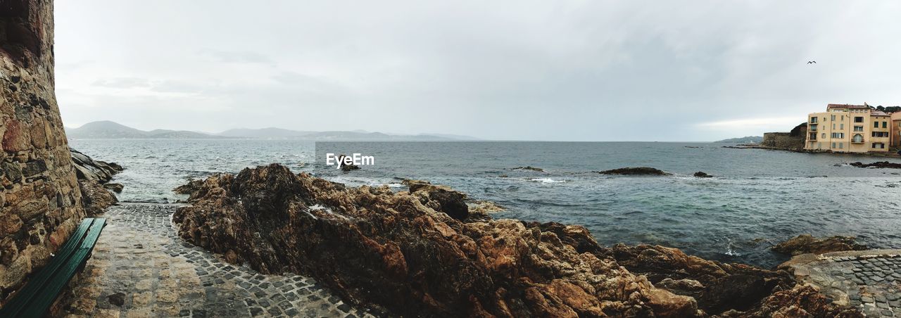 PANORAMIC VIEW OF SEA AND ROCKS