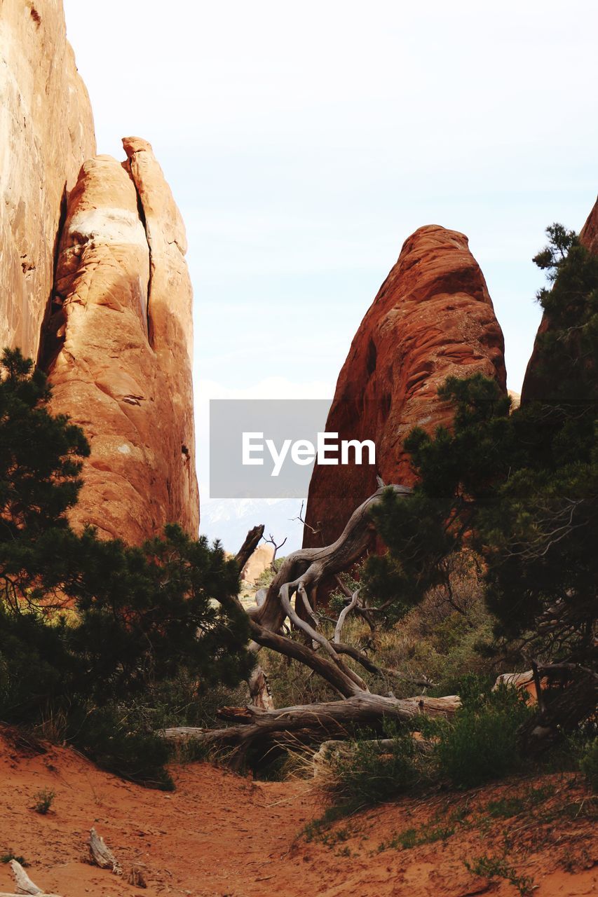 ROCK FORMATION ON LAND AGAINST SKY