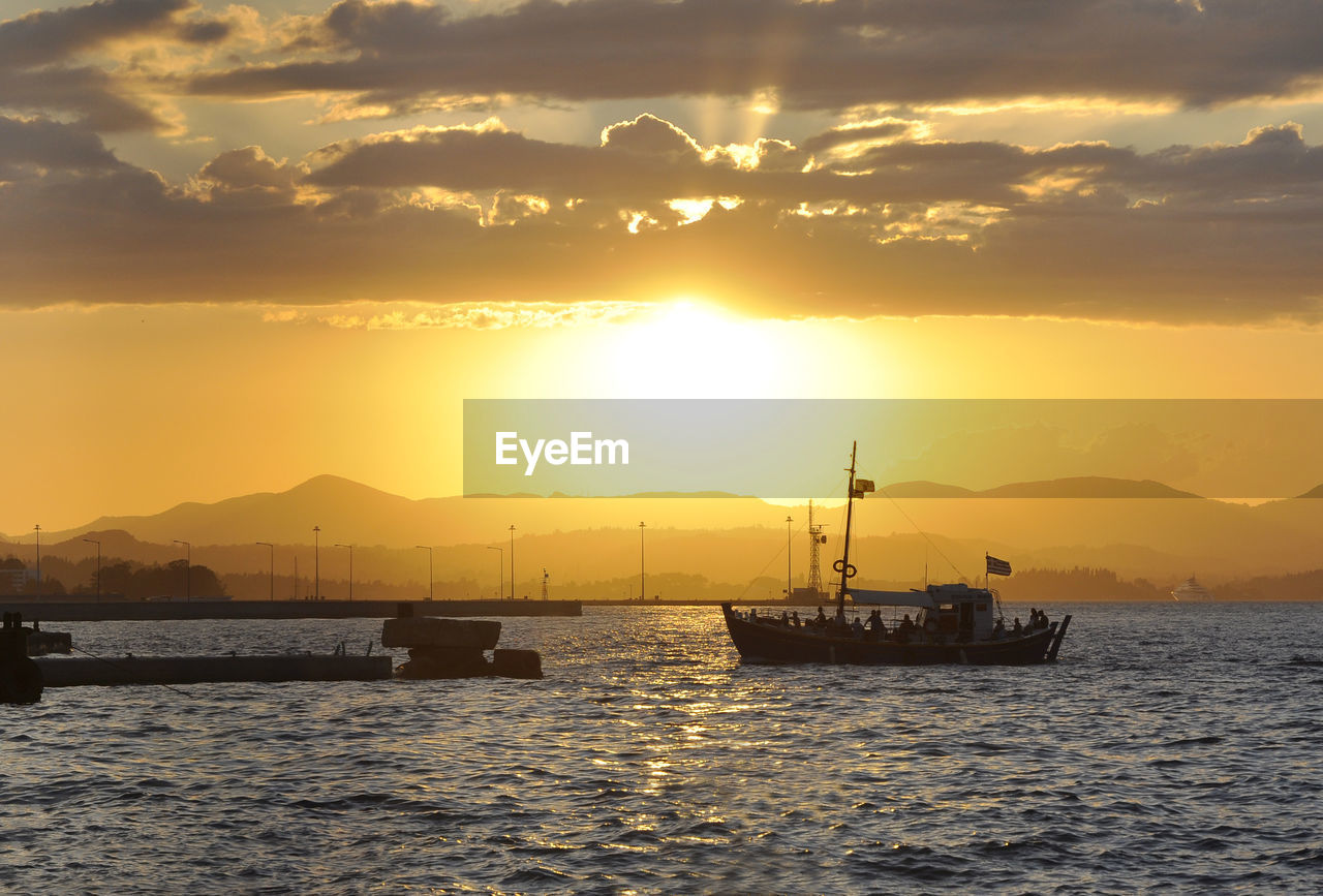 SCENIC VIEW OF SEA AGAINST ORANGE SKY