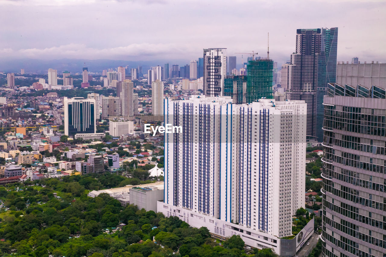 High angle view of buildings in city against sky