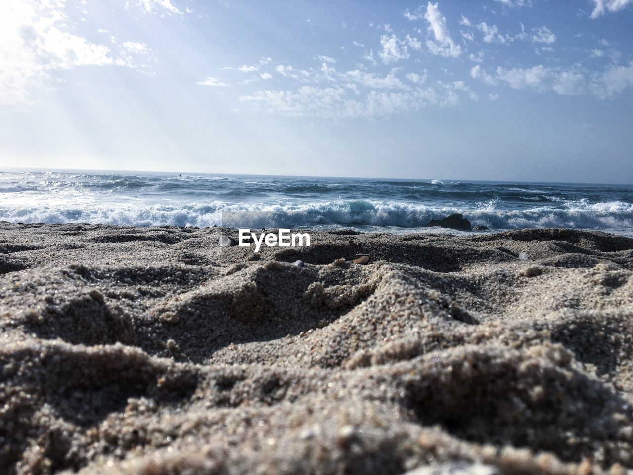 Scenic view of beach against sky