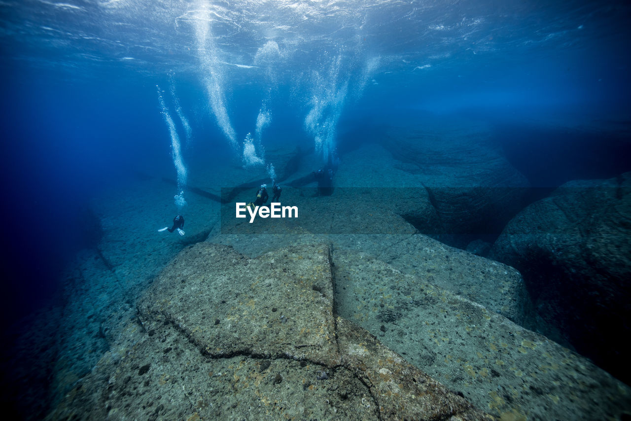 People scuba diving in sea