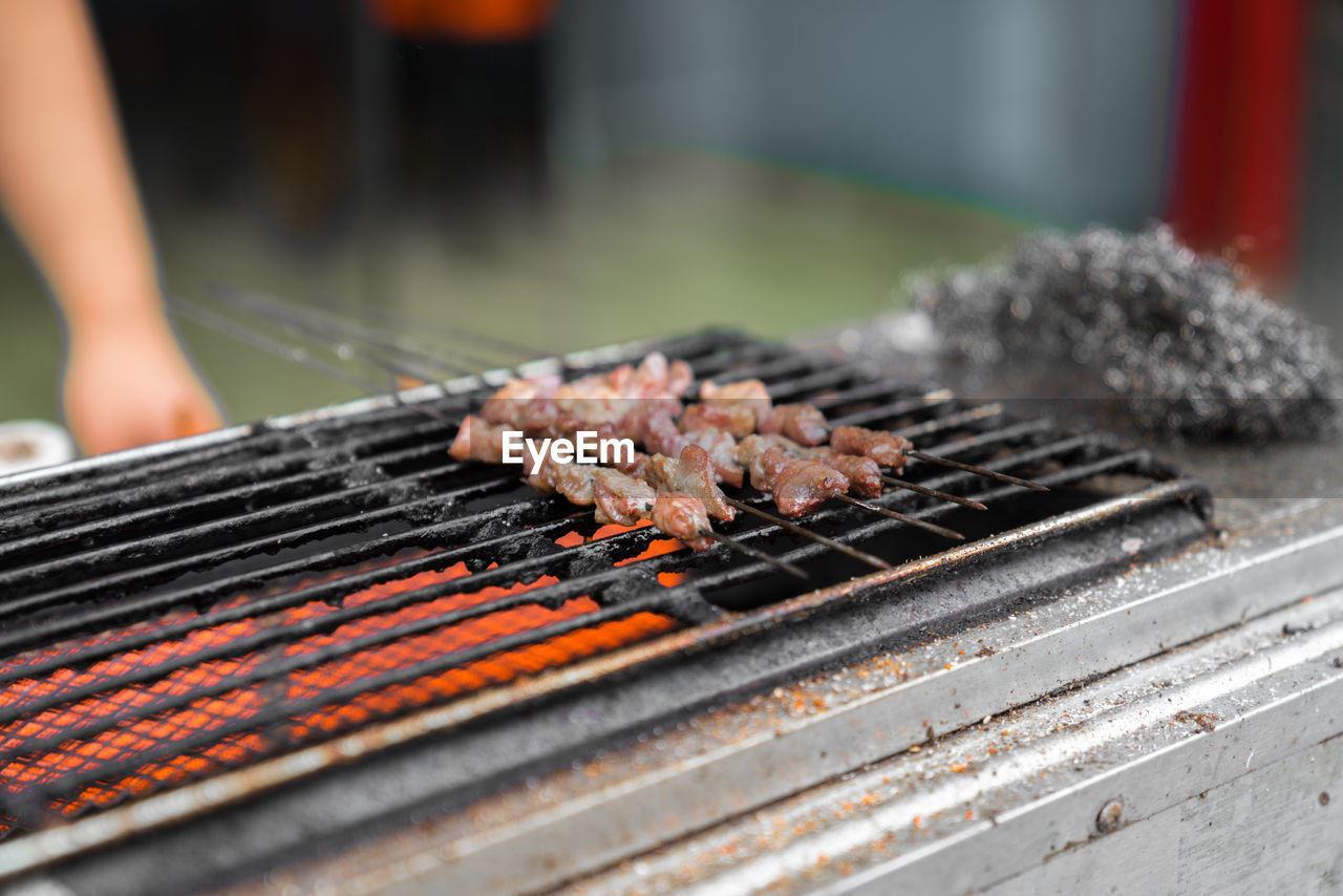 Close-up of meat on barbecue grill