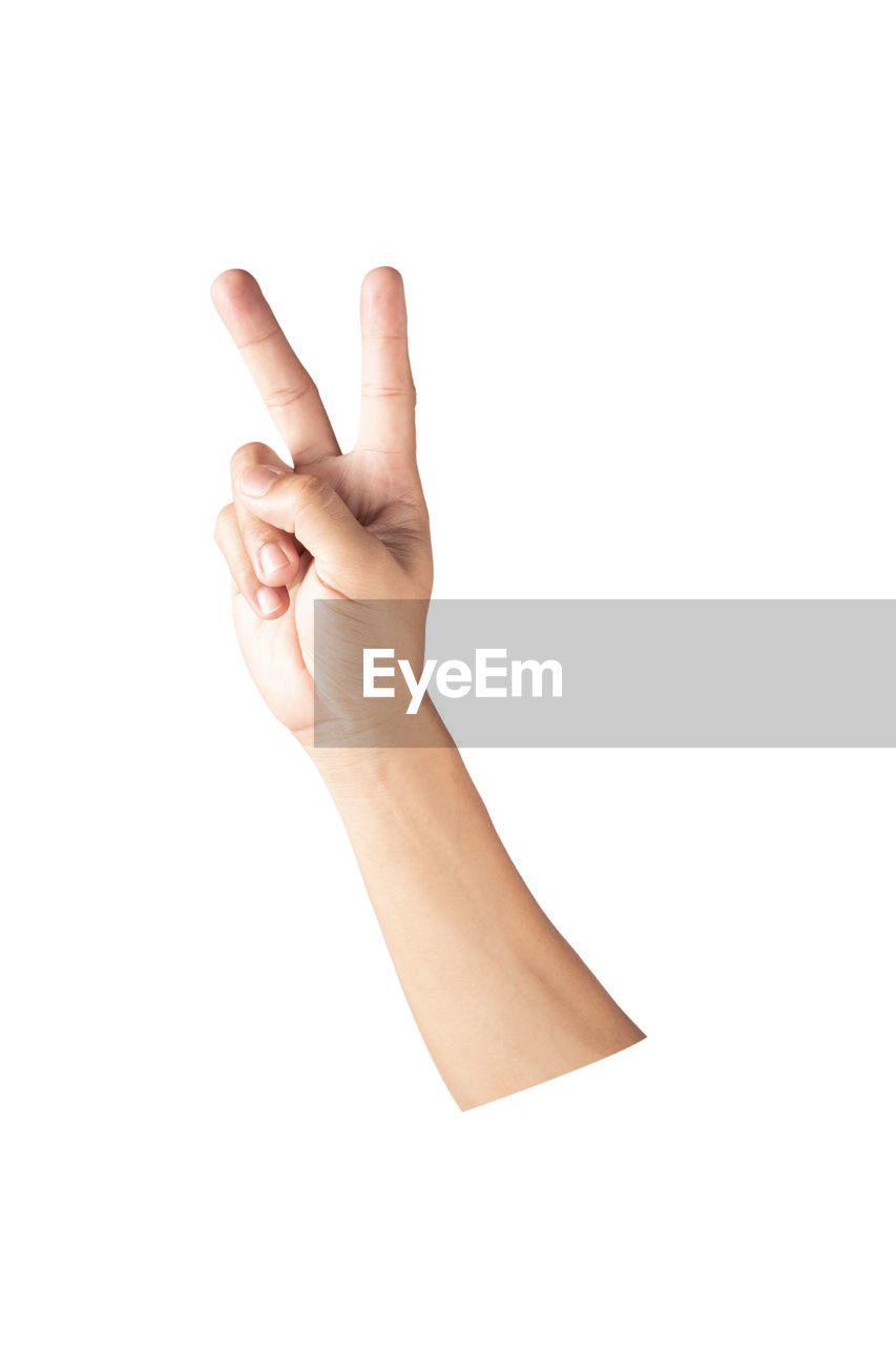 CLOSE-UP OF PERSON HAND ON WHITE BACKGROUND