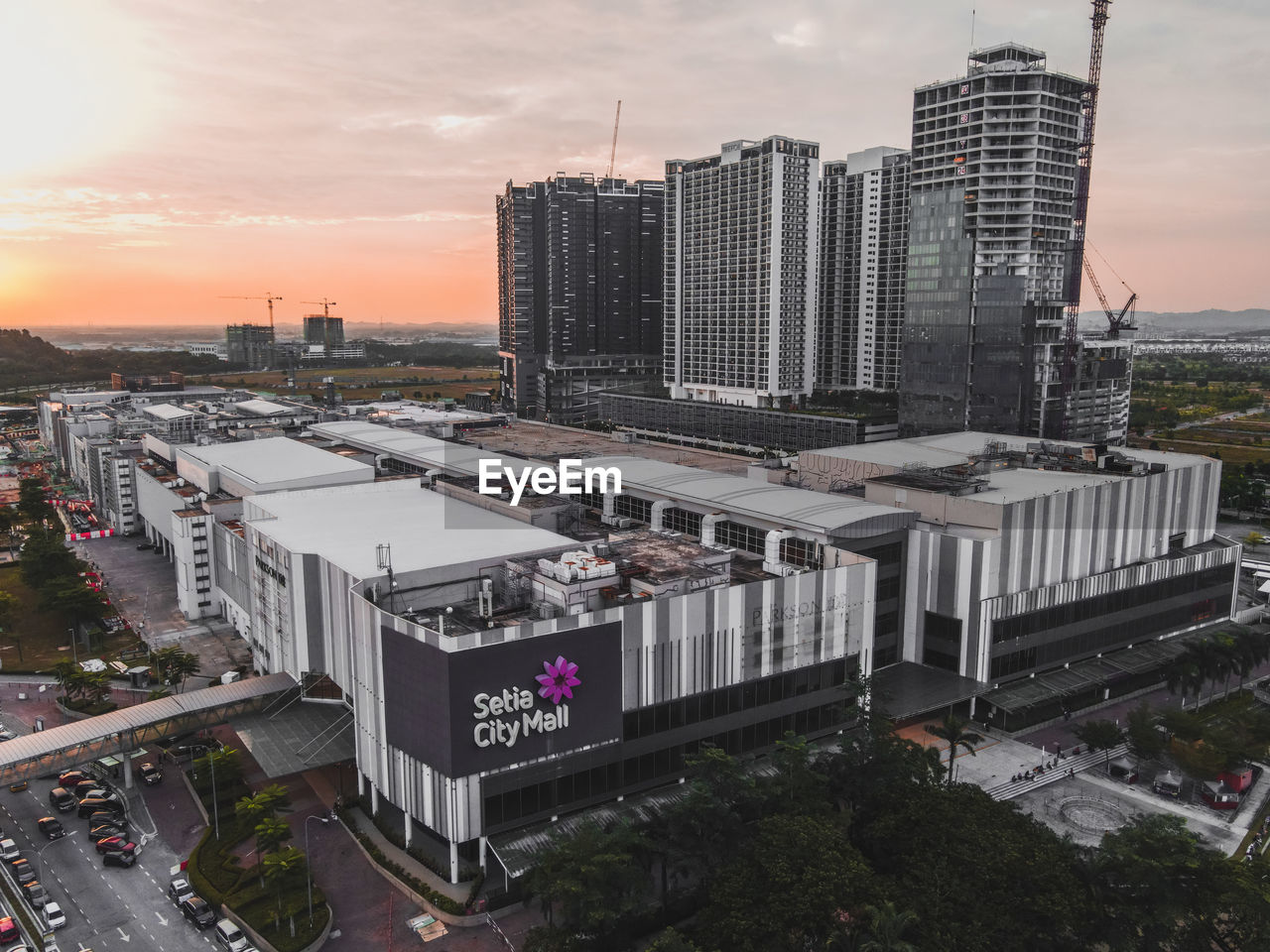 MODERN BUILDINGS AGAINST SKY DURING SUNSET