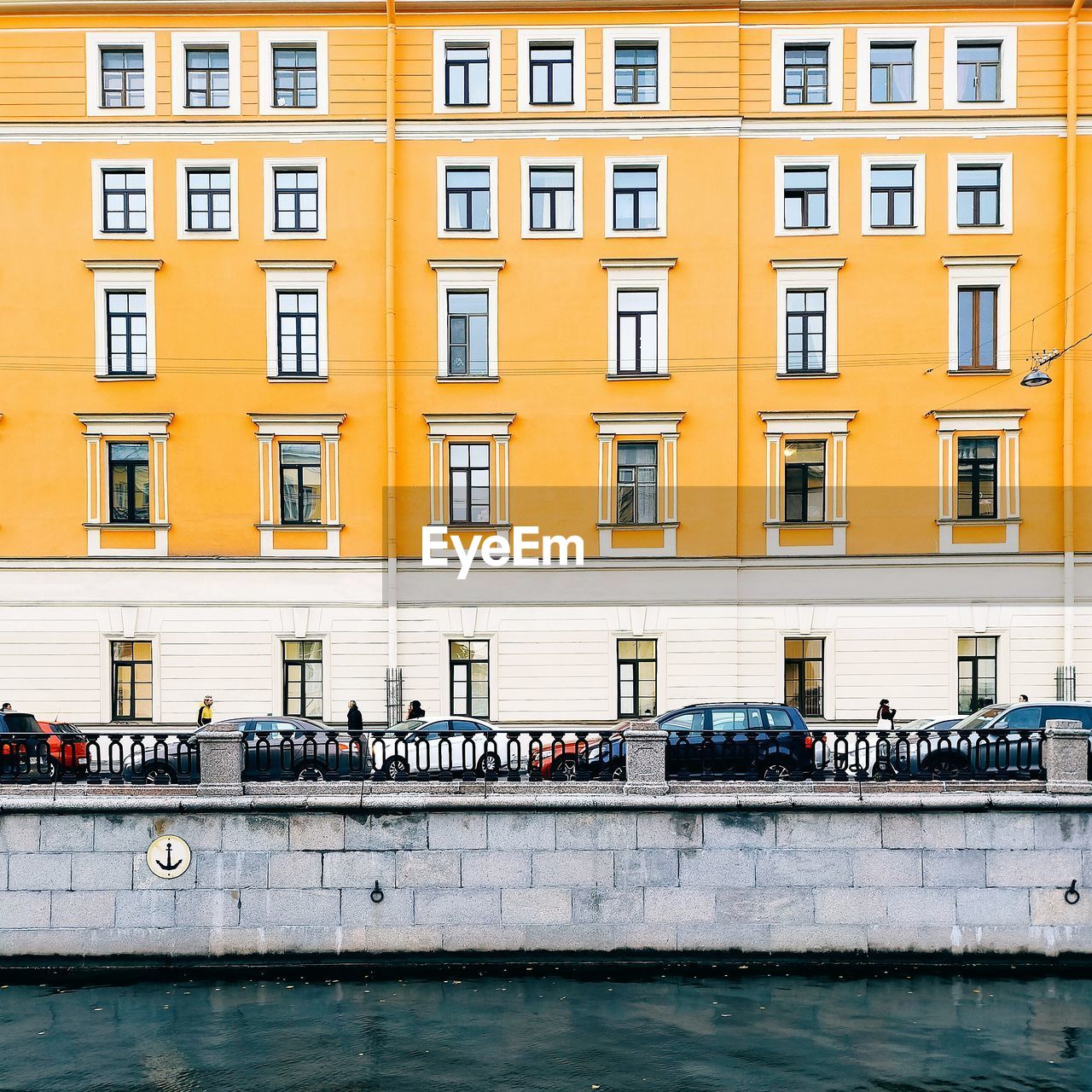 VIEW OF YELLOW BUILDING WITH WATERFRONT