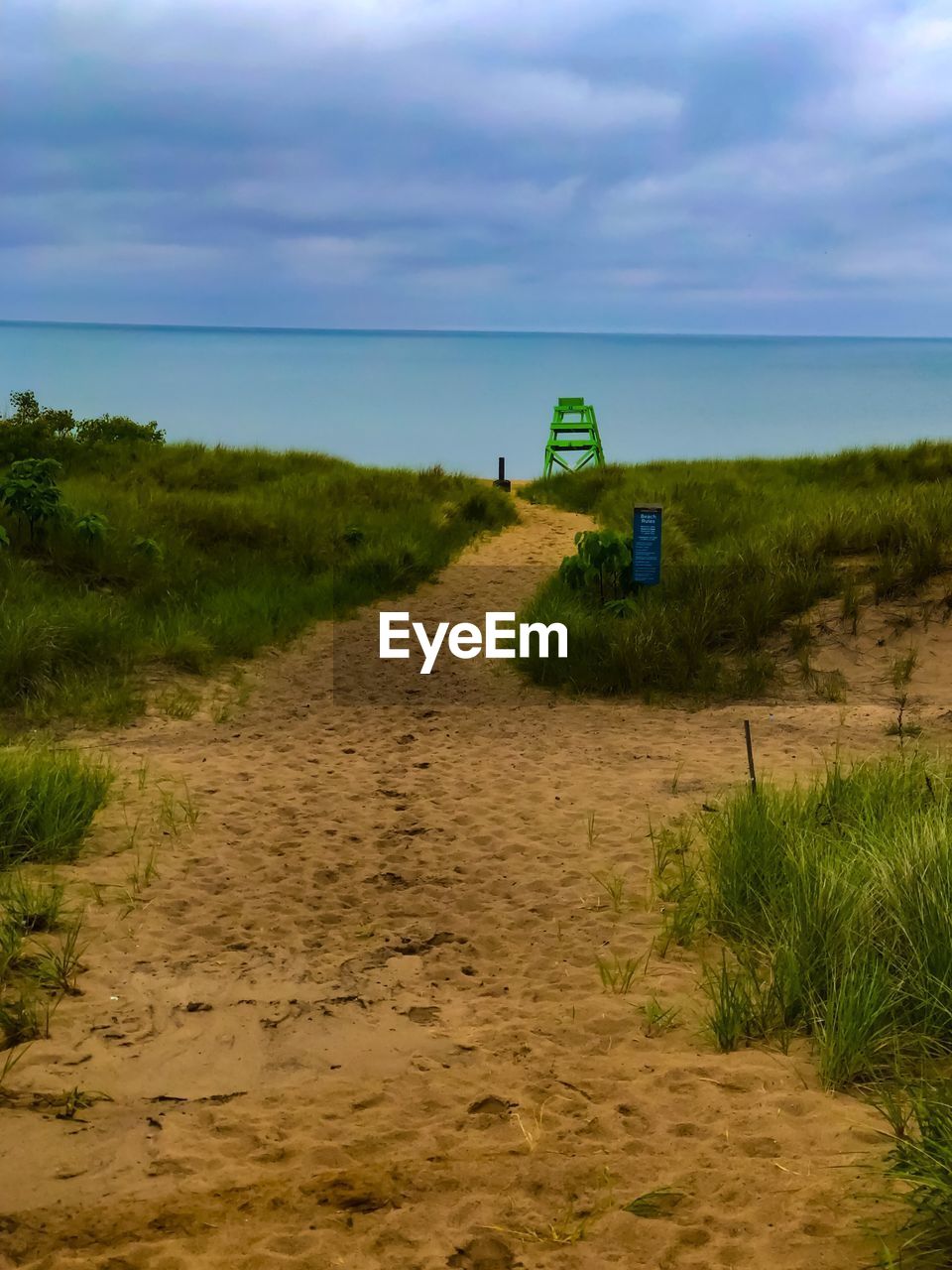 SCENIC VIEW OF SANDY BEACH AGAINST SKY