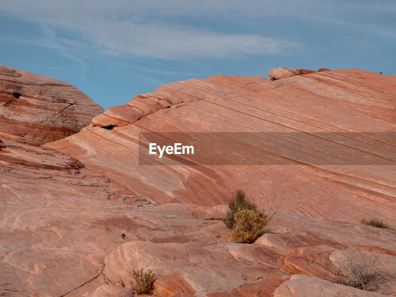 SCENIC VIEW OF ROCK FORMATIONS ON DESERT AGAINST SKY